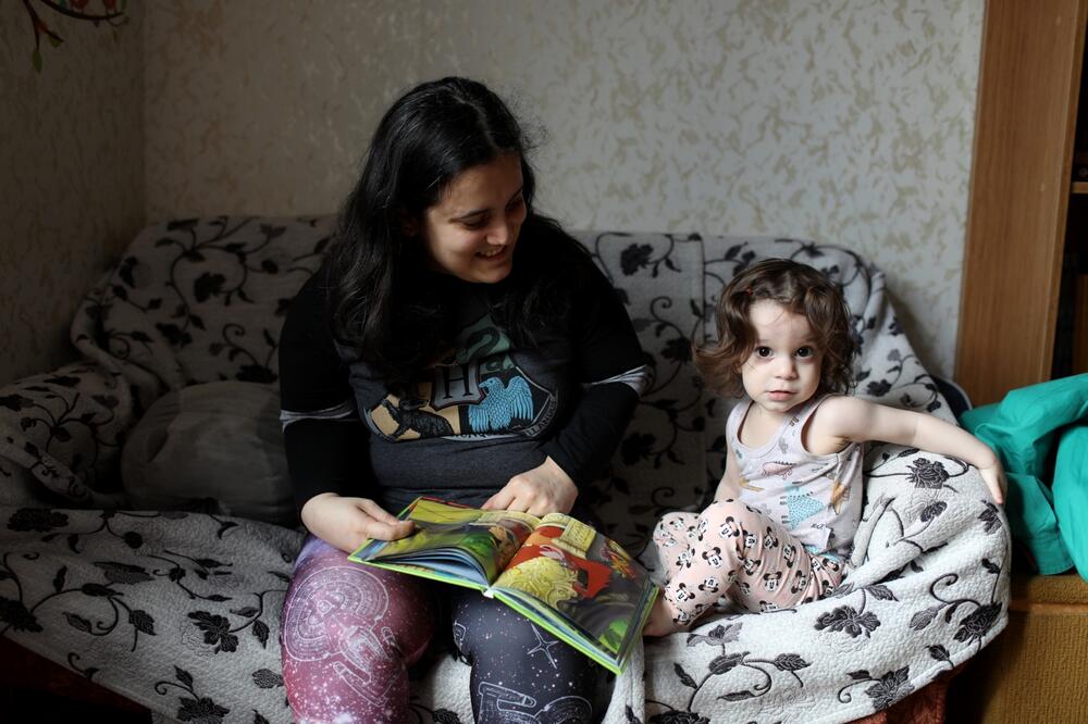 Anna Maisuradze at home with her daughter. 