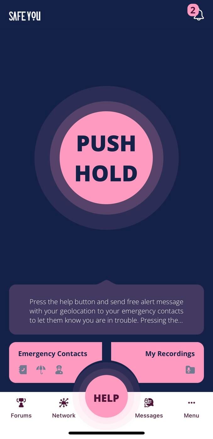 Screenshot of the SafeYOU app featuring a large pink button in the centre that reads "PUSH HOLD" on a navy blue background. Along the bottom there is another smaller pink button in the centre that reads "HELP" with buttons for "Emergency Contacts" and "My Recordings" on either side. A bar along the bottom in white has more buttons: Forums [with a trophy icon], Network [with node icon], Messages [with message bubble icon] and Menu [ellipses icon]