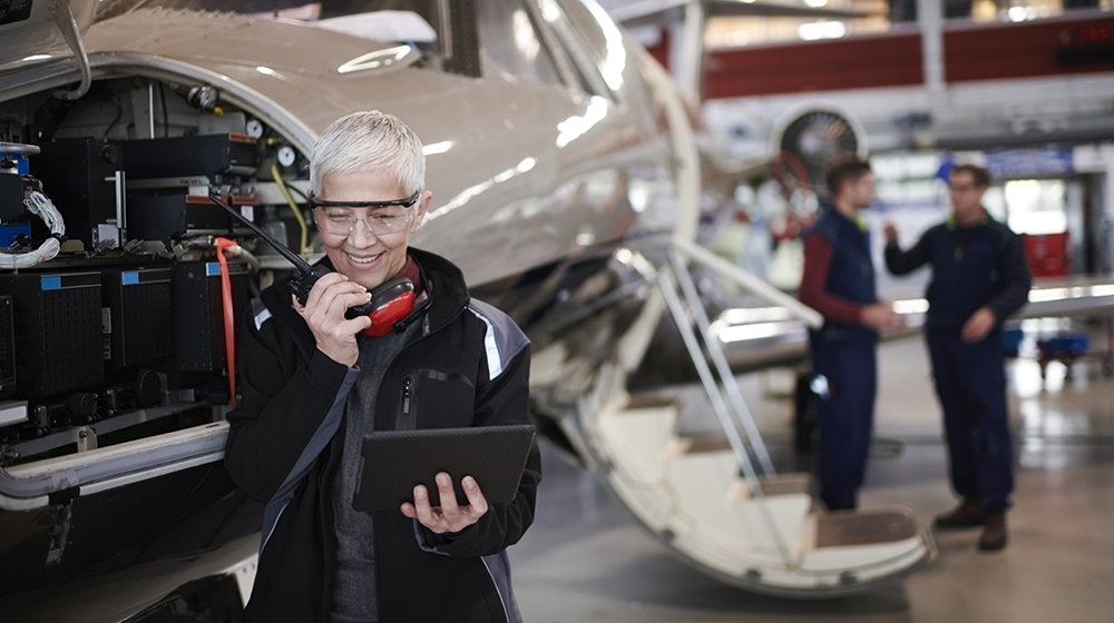 An older person who works as a technician on airplanes.