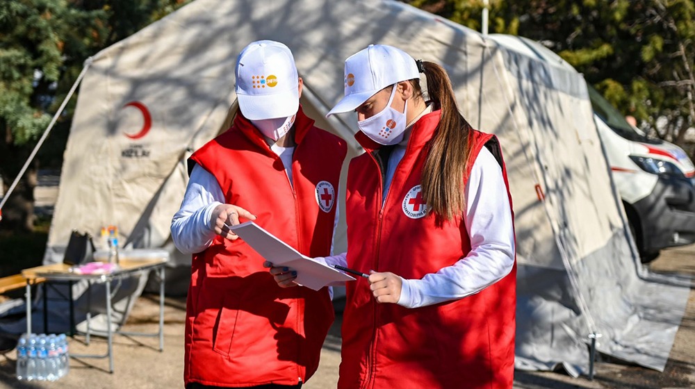 Red Cross volunteers discuss logistics at the mobile gynaecological clinic in Sveti Nikole municipality, North Macedonia