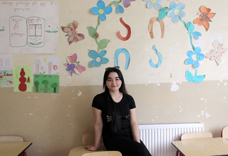 Student Alenda Bakhtiarova in a classroom at Karajala Public School