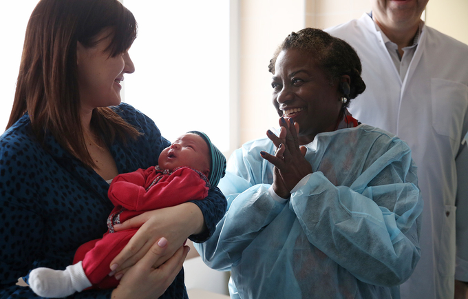 UNFPA Executive Director Dr. Natalia Kanem meets a newborn baby at a maternity hospital in Belarus