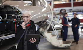 An older person who works as a technician on airplanes.